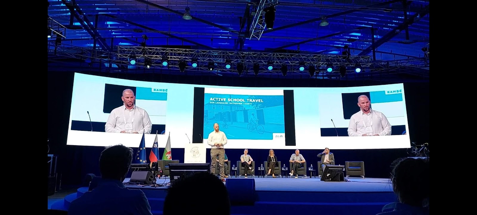A group of people on a stage
Description automatically generated